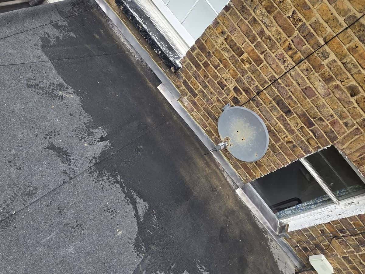 New flat roof on the back of a brick period house